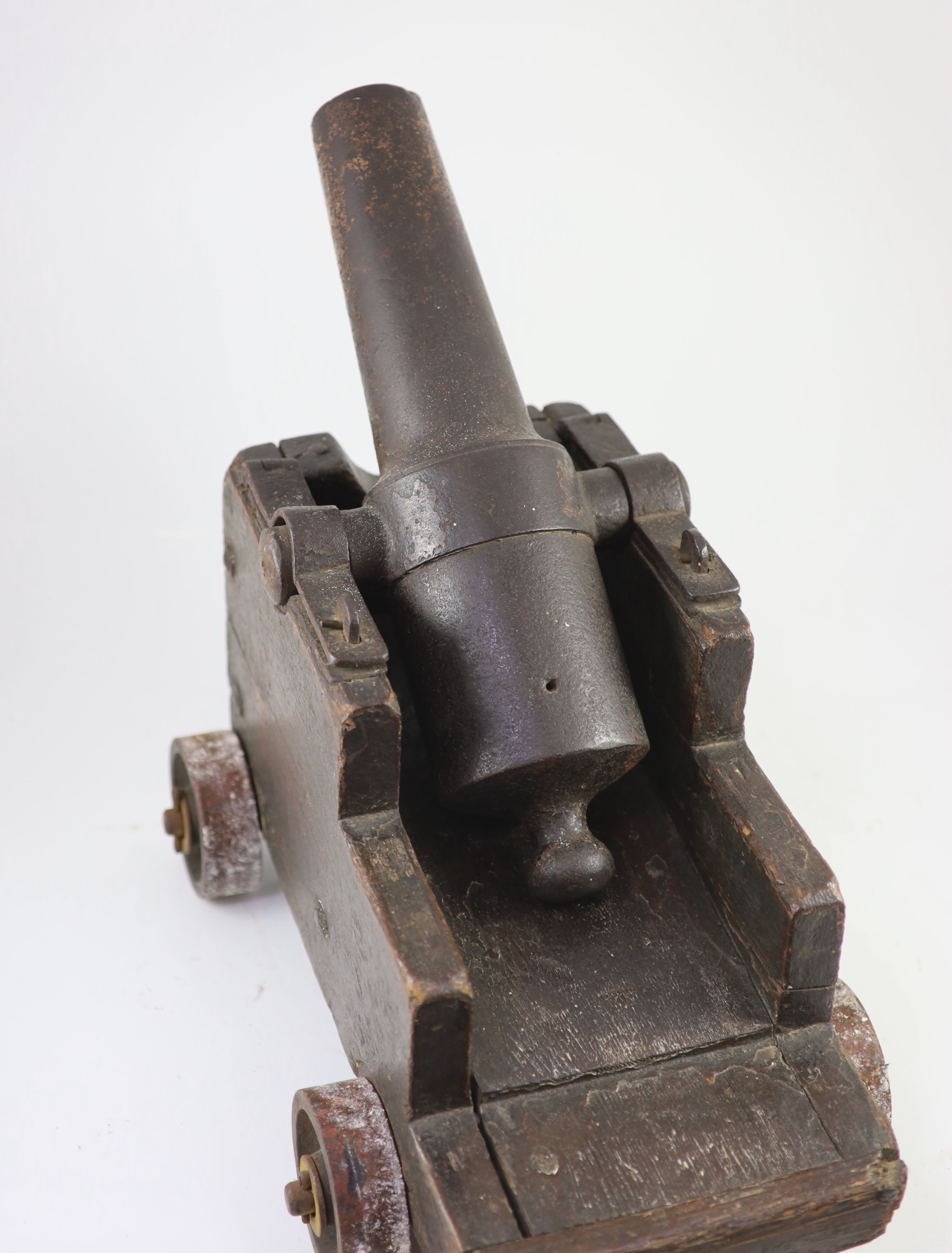 A cast iron starting cannon, probably 18th/19th century, H 35cm. L 59cm. D 31cm.